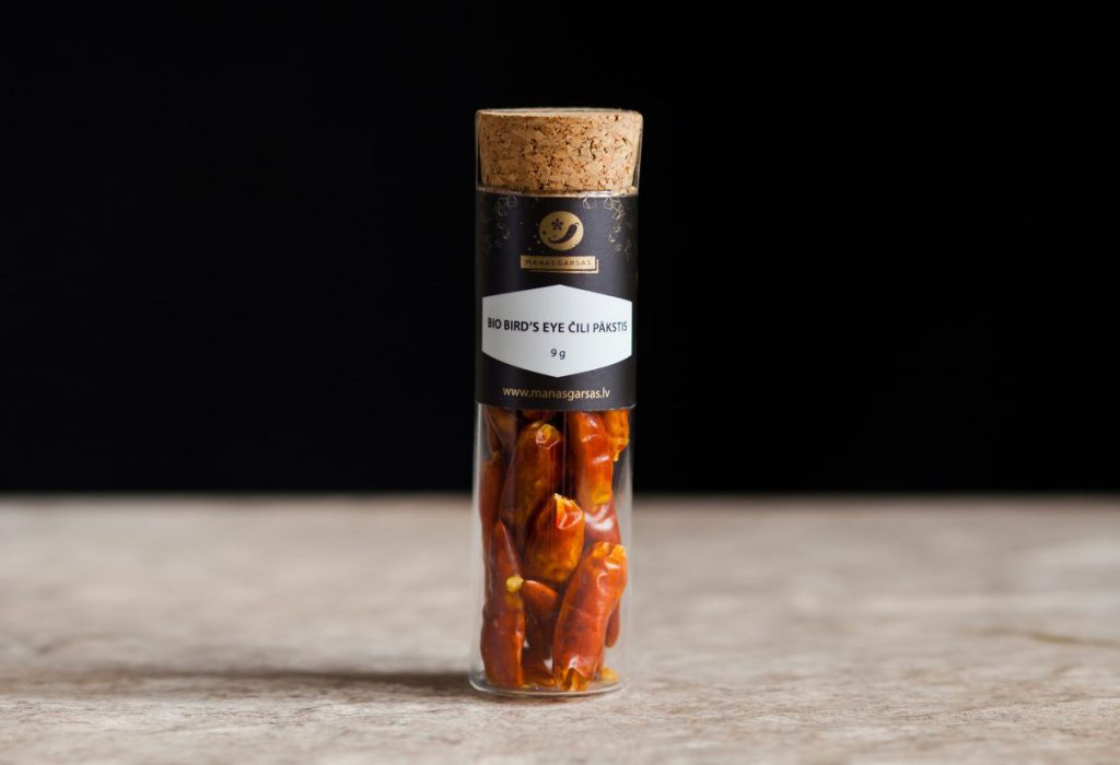 Bird's eye chili pods in a large tube